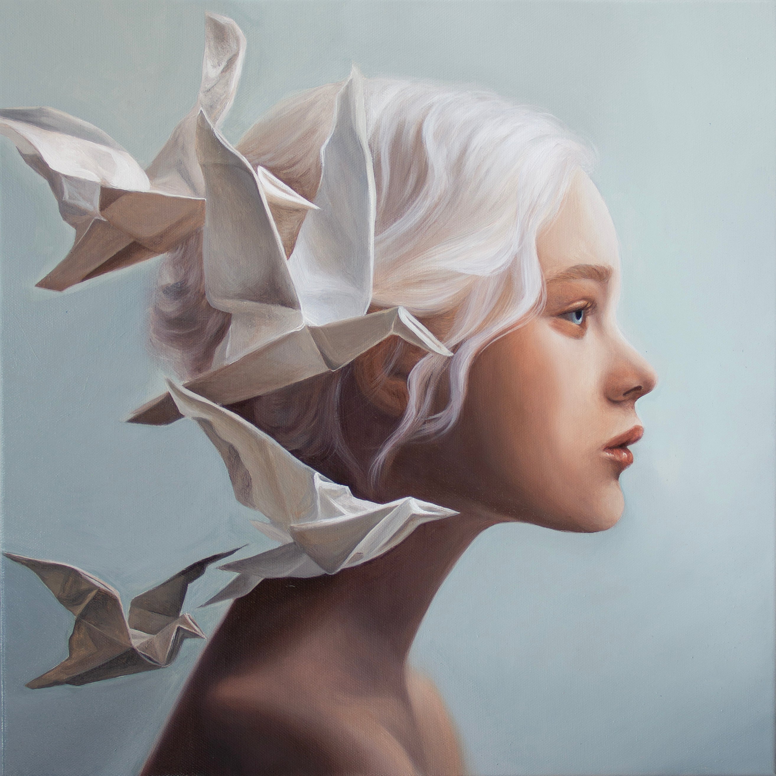 Unfold, original oil painting by Kareen Kalush, captures a surreal portrait painting of a young woman in profile with pale silver-white hair adorned with folded white paper origami flying birds, set against a soft light blue-gray background.